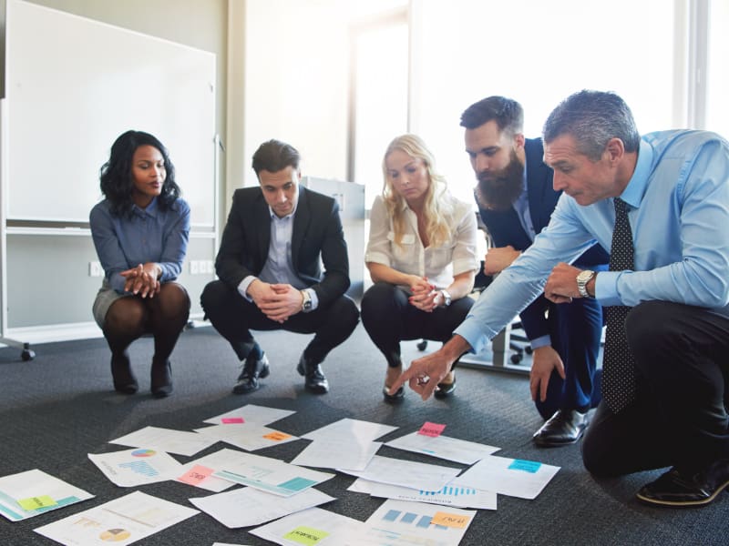 Entrepreneur Vs Intrapreneur business team brainstorming in office