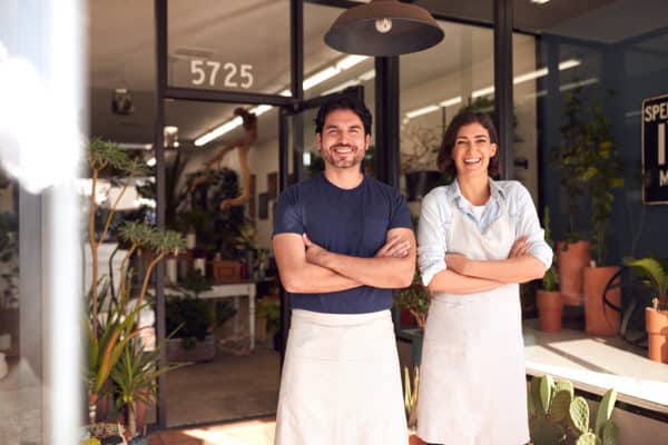 plant shop portrait of smiling owners outside featured image