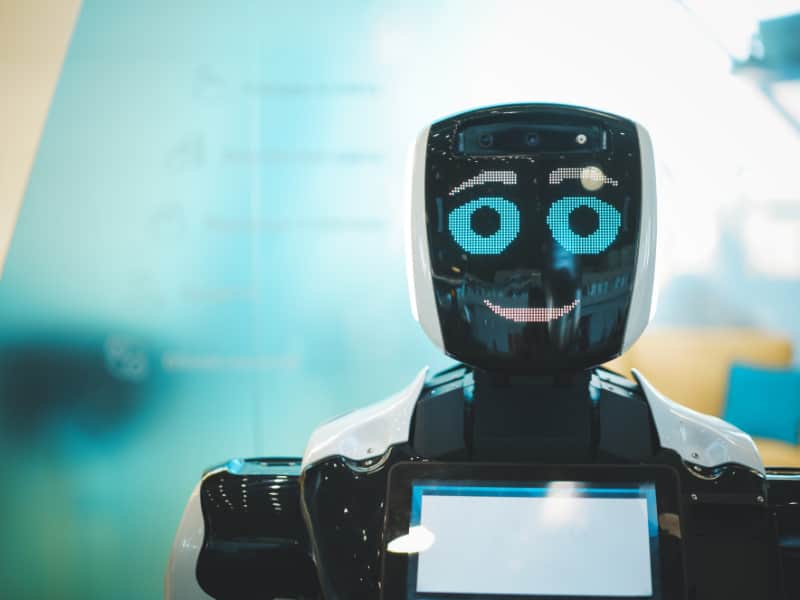 marketing trends - smiling robot assistant with artificial intelligence