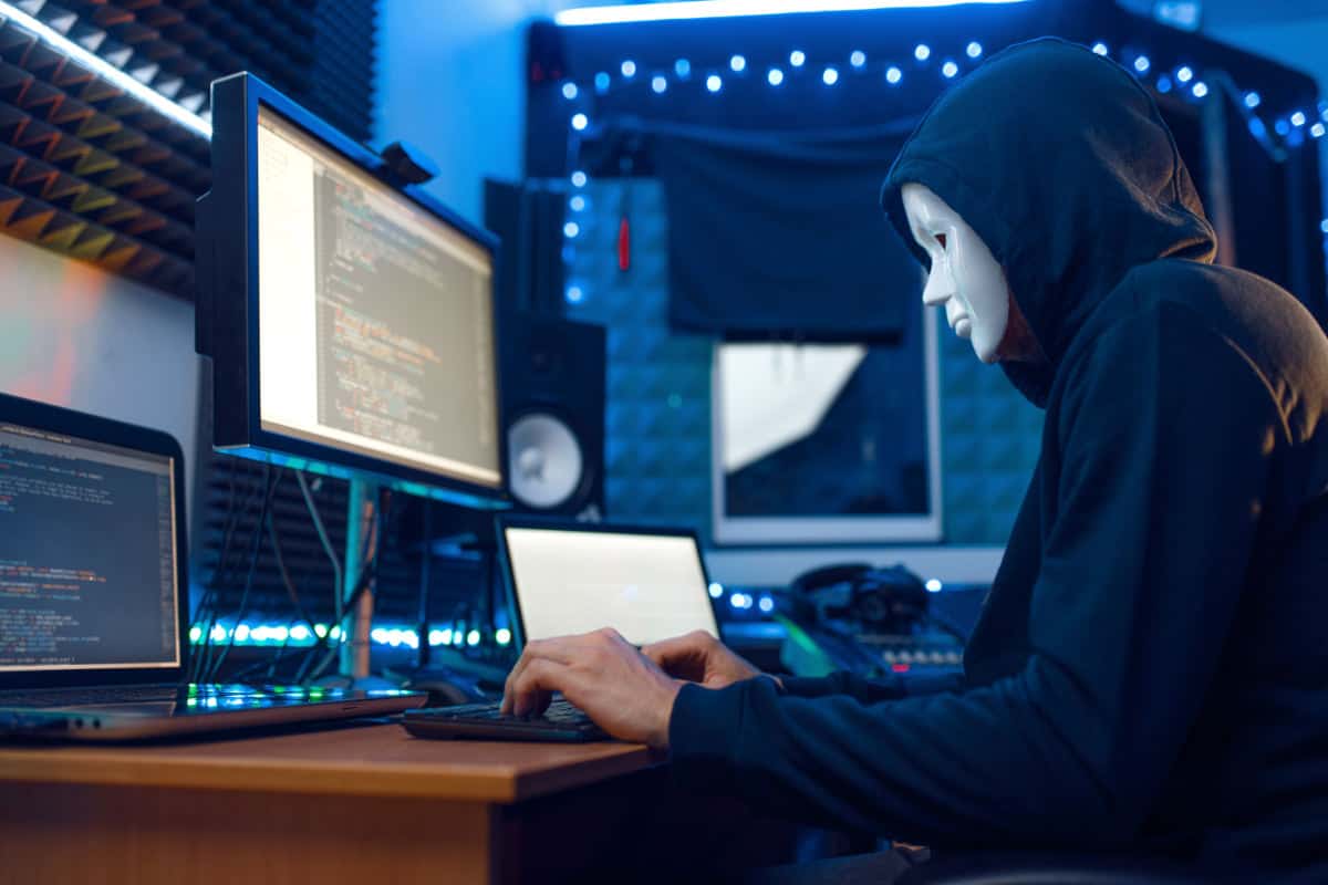 website security hacker in mask hood