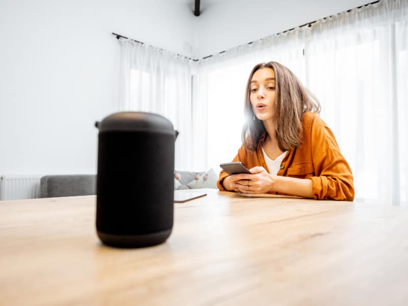 woman controlling home devices with a voice command